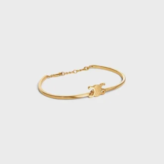 Triomphe scharnierende armband van messing met gouden afwerking