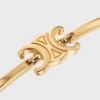 Triomphe scharnierende armband van messing met gouden afwerking