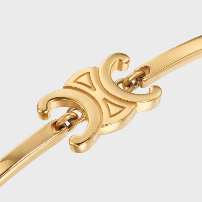 Triomphe scharnierende armband van messing met gouden afwerking