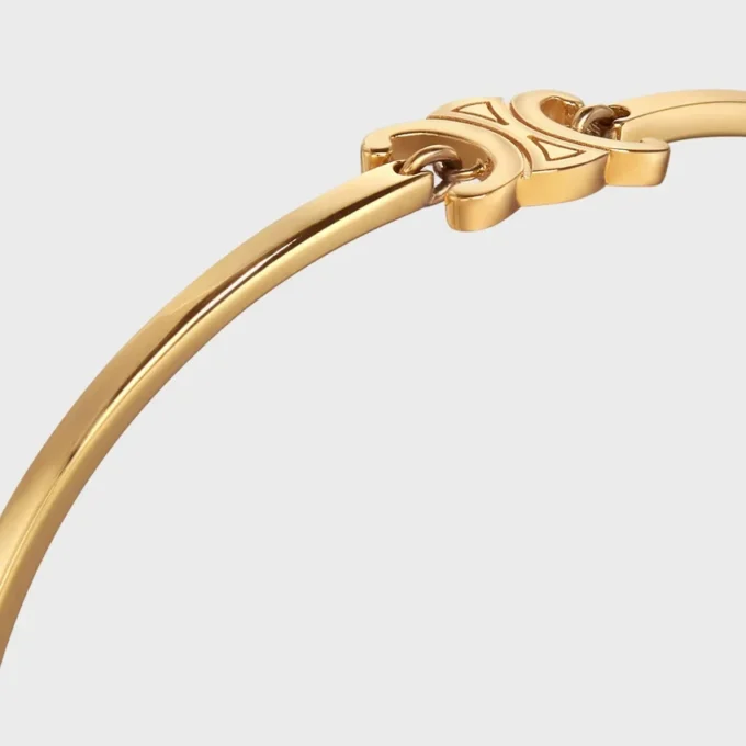 Triomphe scharnierende armband van messing met gouden afwerking